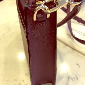Brand new Kate Spade cross body in deep plum